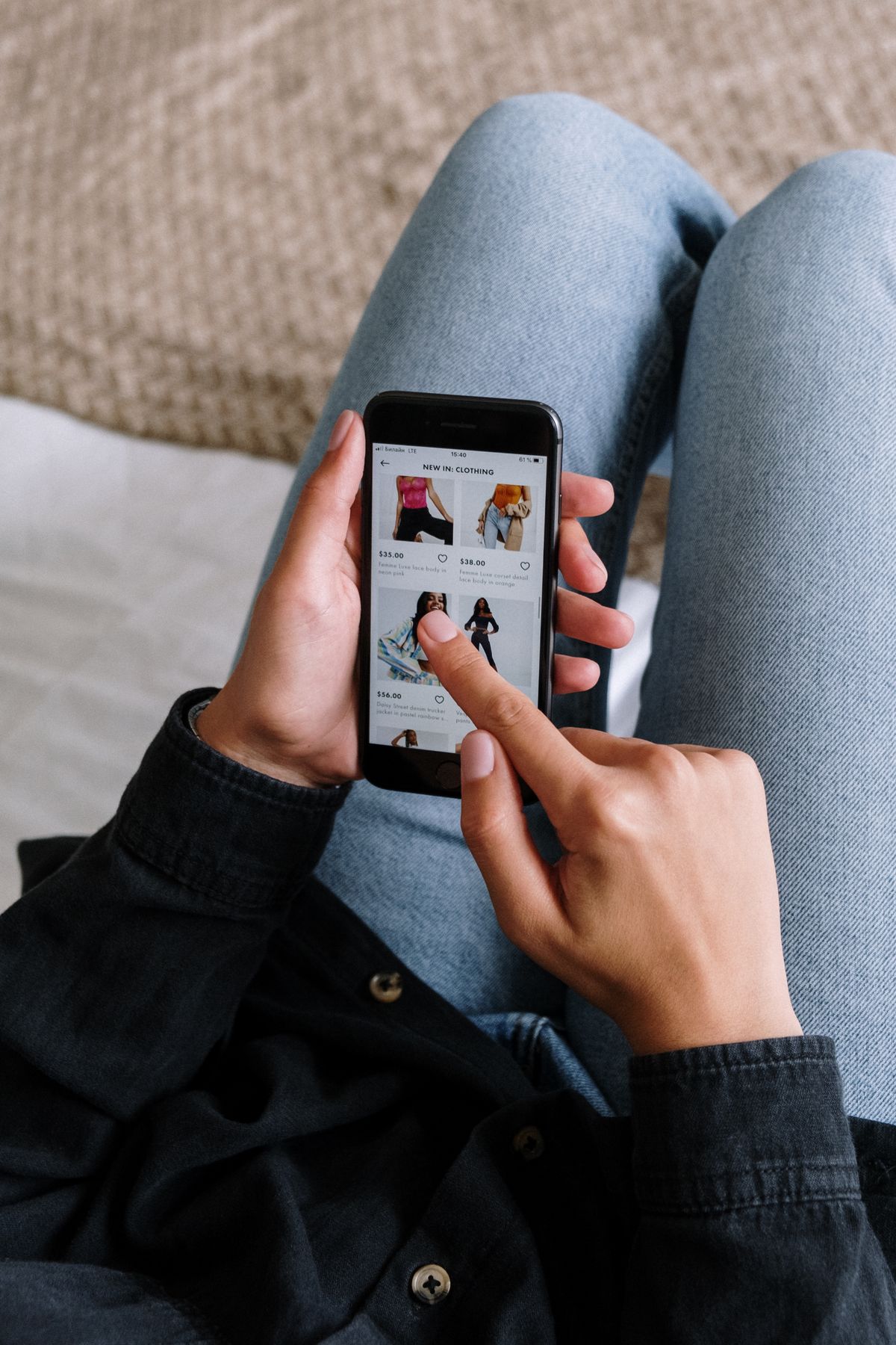 A customer shopping a store's mobile app on a phone